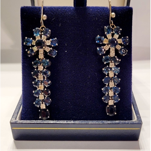 50 - A FANTASTIC PAIR OF WHITE GOLD BLUE SAPPHIRE & DIAMOND DROP EARRINGS, each with a starburst style de... 