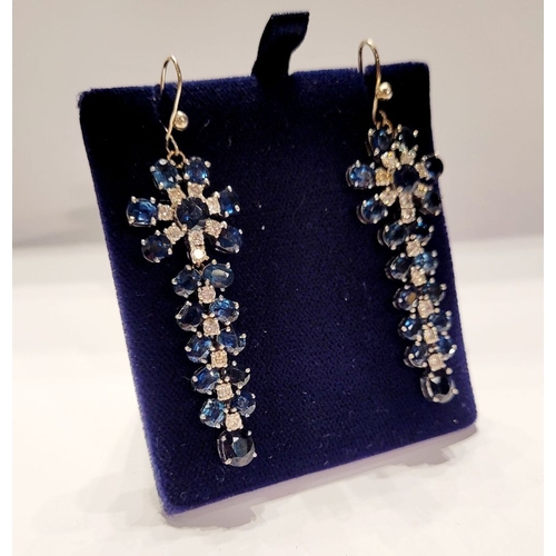 50 - A FANTASTIC PAIR OF WHITE GOLD BLUE SAPPHIRE & DIAMOND DROP EARRINGS, each with a starburst style de... 