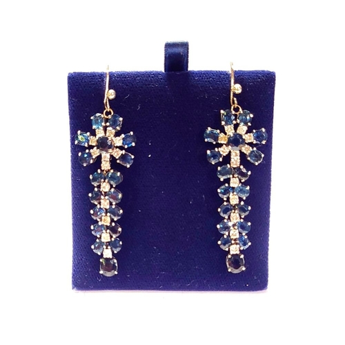 50 - A FANTASTIC PAIR OF WHITE GOLD BLUE SAPPHIRE & DIAMOND DROP EARRINGS, each with a starburst style de... 