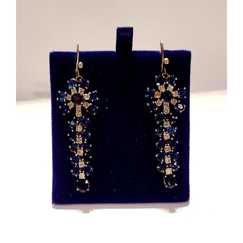 50 - A FANTASTIC PAIR OF WHITE GOLD BLUE SAPPHIRE & DIAMOND DROP EARRINGS, each with a starburst style de... 