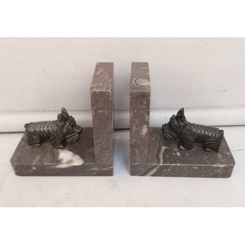 59 - A LOVELY PAIR OF ART DECO MANTELPIECE ORNAMENTS OR BOOKENDS modelled as Scottie dogs on marble bases... 