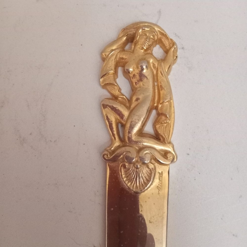 65 - A MID 20TH CENTURY GILT METAL PAPER KNIFE signed F.Bouniol, handle in the form of female nude with a... 