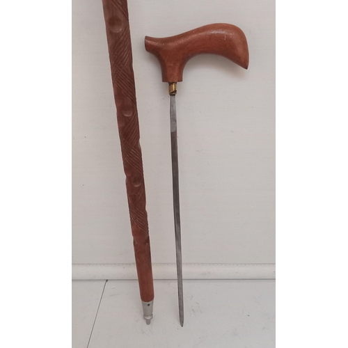 66 - A CARVED VINTAGE SWORDSTICK, Dimensions: 86cm long overall.