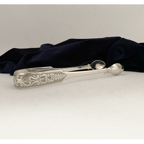 7 - A GEORGE III DUBLIN SILVER SUGAR TONGS, by Matthew West & James England, Dublin c.1818. In the fiddl... 