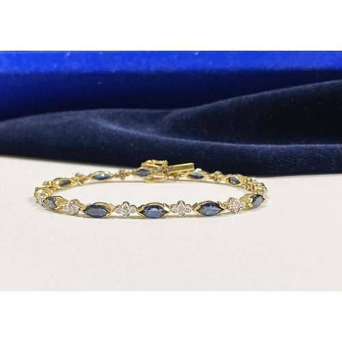 10 - A FANTASTIC 14CT YELLOW GOLD SAPPHIRE & DIAMOND TENNIS BRACELET, featuring thirteen marquise cut sap... 