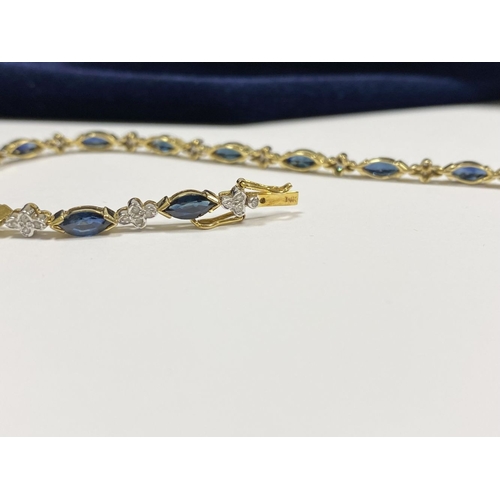 10 - A FANTASTIC 14CT YELLOW GOLD SAPPHIRE & DIAMOND TENNIS BRACELET, featuring thirteen marquise cut sap... 