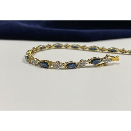 10 - A FANTASTIC 14CT YELLOW GOLD SAPPHIRE & DIAMOND TENNIS BRACELET, featuring thirteen marquise cut sap... 