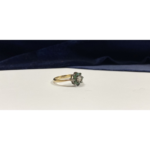 108 - A GEMSET GOLD & SILVER FLOWER RING, with central round cut clear gemstone surrounded by eight round ... 