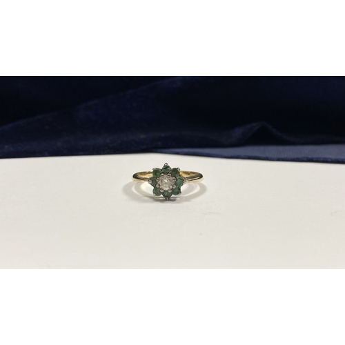 108 - A GEMSET GOLD & SILVER FLOWER RING, with central round cut clear gemstone surrounded by eight round ... 