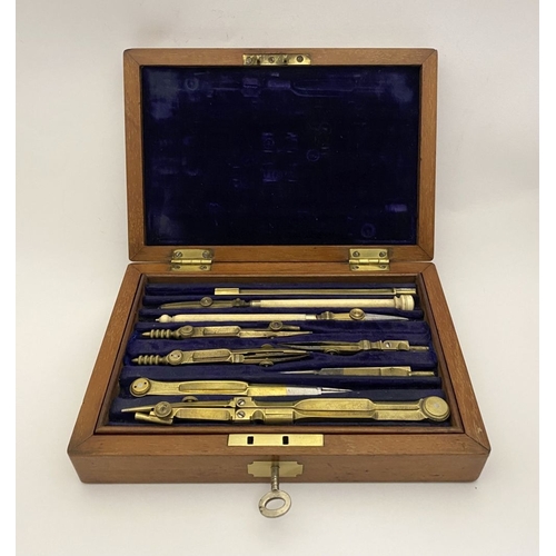 109 - A VINTAGE HARDWOOD CASED SET OF DRAUGHTSMAN TOOLS, the hardwood case with brass cartouche to top and... 