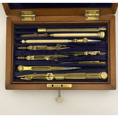 109 - A VINTAGE HARDWOOD CASED SET OF DRAUGHTSMAN TOOLS, the hardwood case with brass cartouche to top and... 