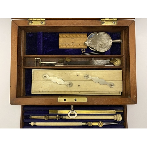 109 - A VINTAGE HARDWOOD CASED SET OF DRAUGHTSMAN TOOLS, the hardwood case with brass cartouche to top and... 