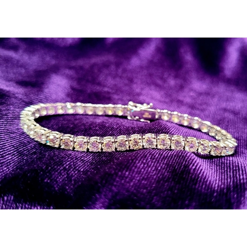 116 - AN 18CT WHITE GOLD DIAMOND TENNIS BRACELET, a lovely sparking diamond bracelet, with 24 stones set i... 