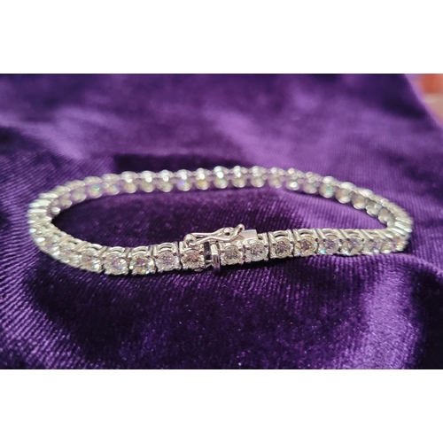 116 - AN 18CT WHITE GOLD DIAMOND TENNIS BRACELET, a lovely sparking diamond bracelet, with 24 stones set i... 