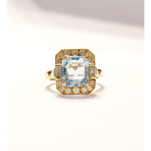 120 - A PRETTY 18CT YELLOW GOLD AQUAMARINE & DIAMOND CLUSTER RING, with a large central pale blue aquamari... 