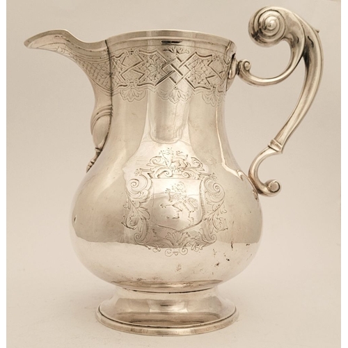 13 - A VERY FINE IRISH GEORGE II SOLID SILVER BEER JUG BY JOHN HAMILTON, circa 1730s, of Dublin. The jug ... 