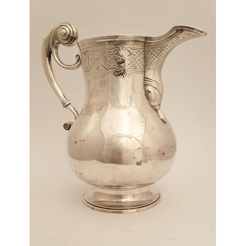 13 - A VERY FINE IRISH GEORGE II SOLID SILVER BEER JUG BY JOHN HAMILTON, circa 1730s, of Dublin. The jug ... 