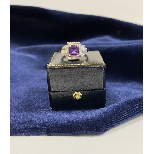 132 - AN 18CT WHITE GOLD AMETHYST & DIAMOND RING, the central amethyst is set in a four prong claw setting... 