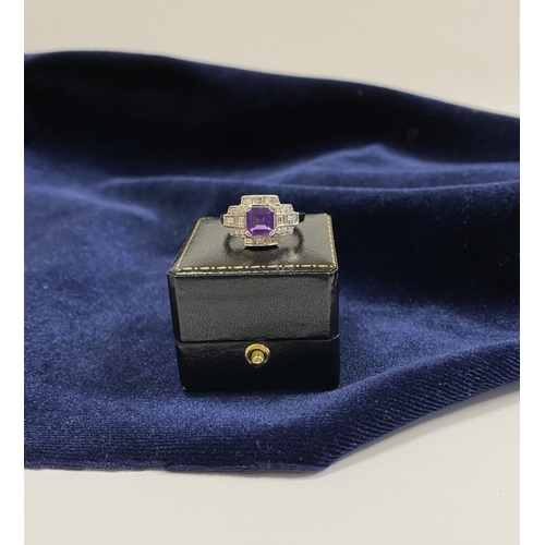 132 - AN 18CT WHITE GOLD AMETHYST & DIAMOND RING, the central amethyst is set in a four prong claw setting... 