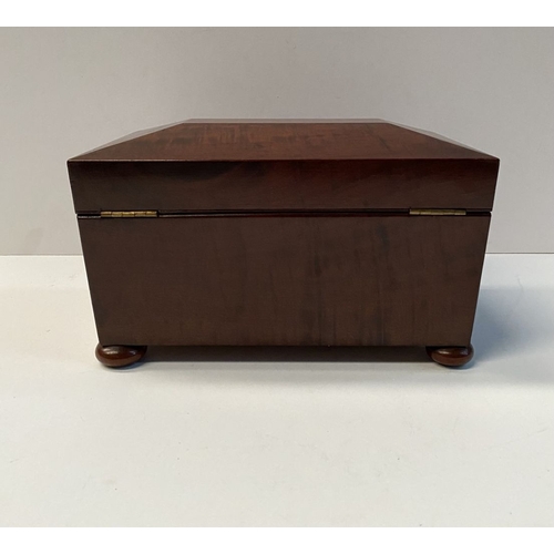 133 - A GOOD MAHOGANY SARCOPHAGUS SHAPED TEA CADDY, with circular brass escutcheon to front, opening to tw... 