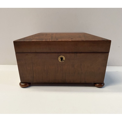 133 - A GOOD MAHOGANY SARCOPHAGUS SHAPED TEA CADDY, with circular brass escutcheon to front, opening to tw... 