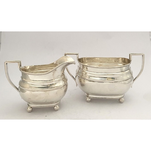 135 - A GEORGE VI SILVER SUGAR BOWL AND MILK JUG, both by EJE Sheffield, c.1941. Of matching design, raise... 