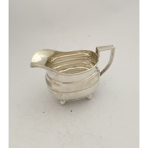 135 - A GEORGE VI SILVER SUGAR BOWL AND MILK JUG, both by EJE Sheffield, c.1941. Of matching design, raise... 