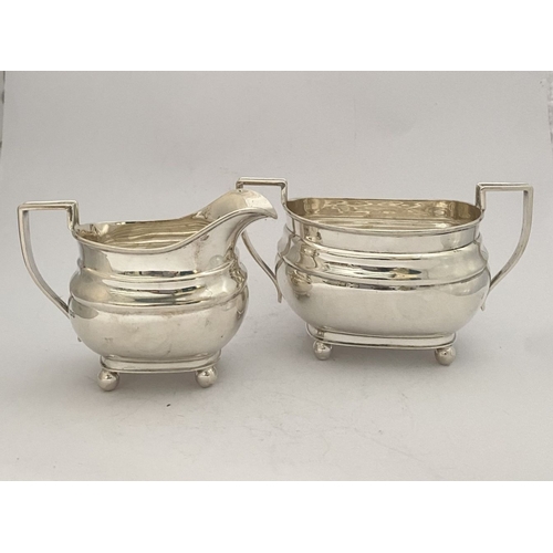 135 - A GEORGE VI SILVER SUGAR BOWL AND MILK JUG, both by EJE Sheffield, c.1941. Of matching design, raise... 