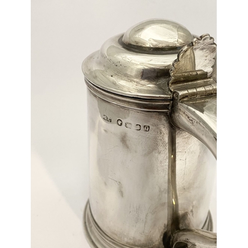 139 - A GEORGE V SILVER TANKARD, by George Unite, Caroline Street, Birmingham c.1865. the hinged domed cov... 