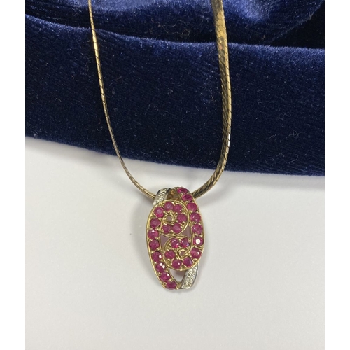 142 - A BEAUTIFUL 9CT YELLOW GOLD DIAMOND & RUBY ENCRUSTED PENDANT NECKLACE, the lovely pendant has a scro... 