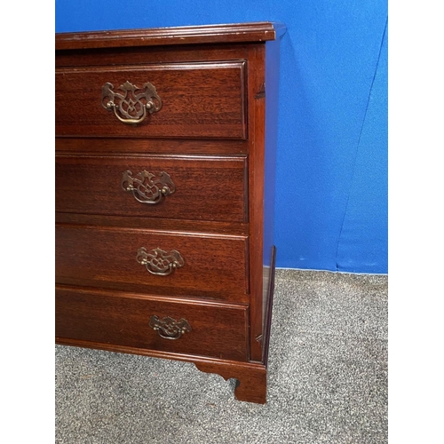 146 - A NEAT SIZED FOUR DRAWER CHEST, with brass handles, raised on bracket feet. Dimensions: 76cm x 47cm ... 