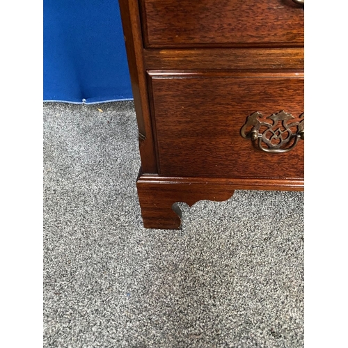 146 - A NEAT SIZED FOUR DRAWER CHEST, with brass handles, raised on bracket feet. Dimensions: 76cm x 47cm ... 