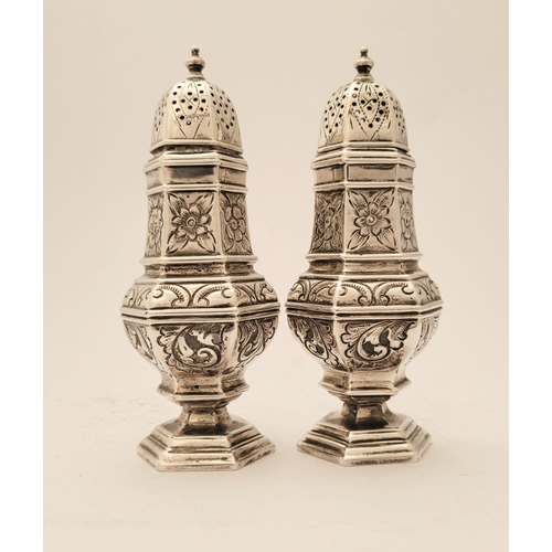 153 - A FINE PAIR OF SILVER SUGAR SIFTERS, each decorated al over with floral and foliage details, Birming... 