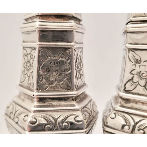 153 - A FINE PAIR OF SILVER SUGAR SIFTERS, each decorated al over with floral and foliage details, Birming... 