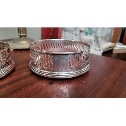 168 - TWO VERY GOOD QUALITY SILVER WINE COASTERS, both with a matching pierced raised gallery surround and... 