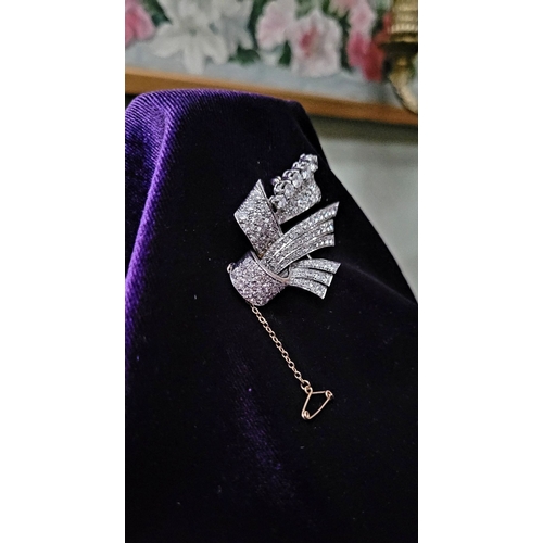 176 - A BEAUTIFUL ART DECO ERA DIAMOND ENCRUSTED RIBBON BROOCH, a stunning piece of jewellery craftsmanshi... 