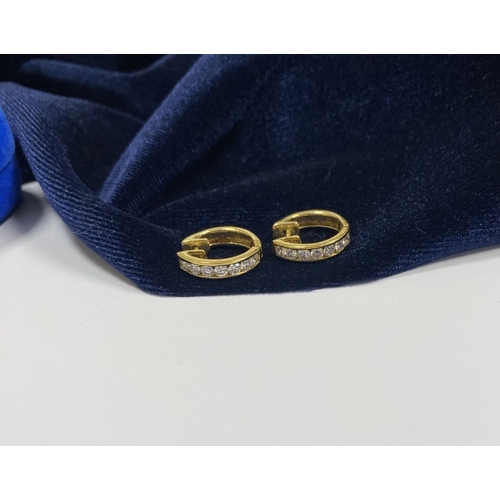 18 - A BEAUTIFUL PAIR OF 18CT GOLD DIAMOND HOOP EARRINGS, each set with seven round cut vibrant diamonds ... 