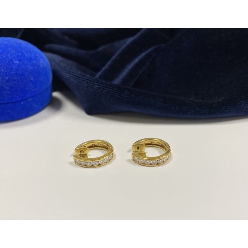 18 - A BEAUTIFUL PAIR OF 18CT GOLD DIAMOND HOOP EARRINGS, each set with seven round cut vibrant diamonds ... 