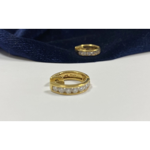 18 - A BEAUTIFUL PAIR OF 18CT GOLD DIAMOND HOOP EARRINGS, each set with seven round cut vibrant diamonds ... 