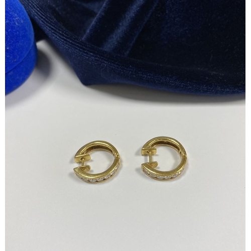 18 - A BEAUTIFUL PAIR OF 18CT GOLD DIAMOND HOOP EARRINGS, each set with seven round cut vibrant diamonds ... 