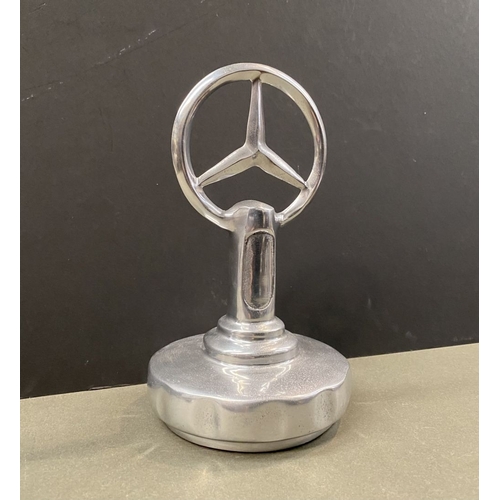 180 - A CHROME TONE MERCEDES DESK ORNAMENT, dimensions: 23cm high approx.