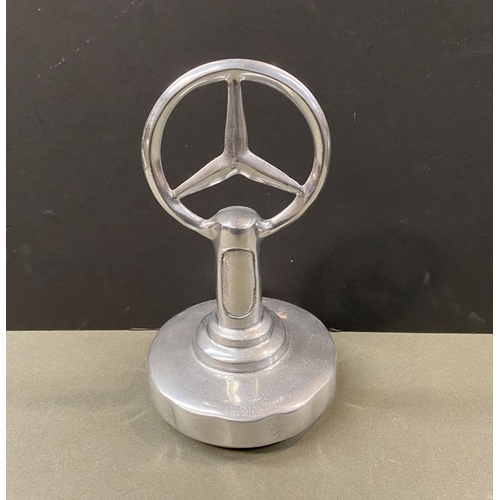 180 - A CHROME TONE MERCEDES DESK ORNAMENT, dimensions: 23cm high approx.