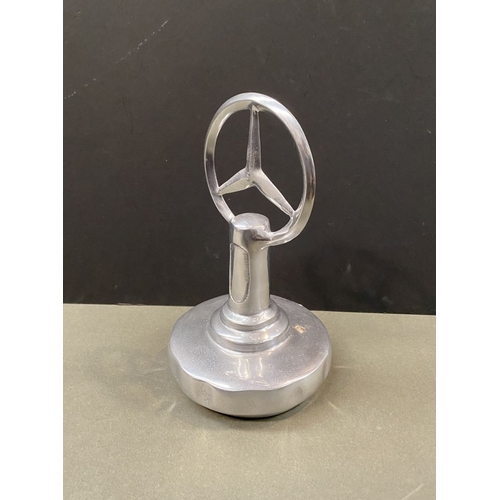 180 - A CHROME TONE MERCEDES DESK ORNAMENT, dimensions: 23cm high approx.