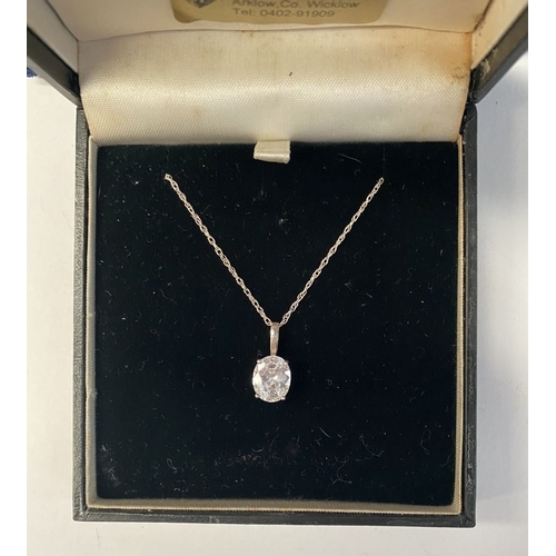 181 - A BEAUTIFUL STERLING SILVER PENDANT NECKLACE, with vibrant oval cut stone, likely cubic zirconia, in... 