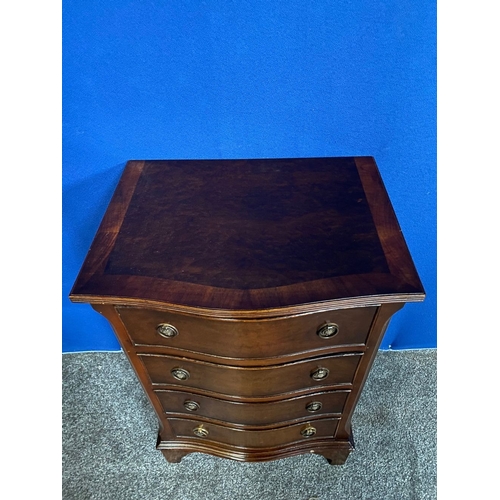 183 - A NEAT SIZED FOUR DRAWER CHEST OF DRAWERS, serpentine shape, with crossbanding to top and reeded bor... 