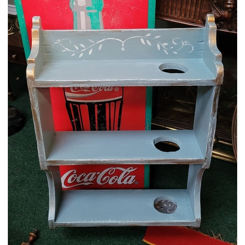 186 - A VINTAGE HAND PAINTED THREE TIER WALL SHELF, with pierced hole on each shelf; possibly for holding ... 