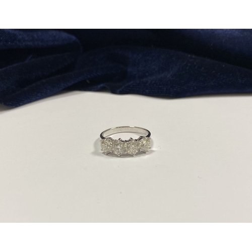 19 - AN 18CT WHITE GOLD FOUR STONE DIAMOND RING, the four round brilliant cut diamonds are claw set, tota... 