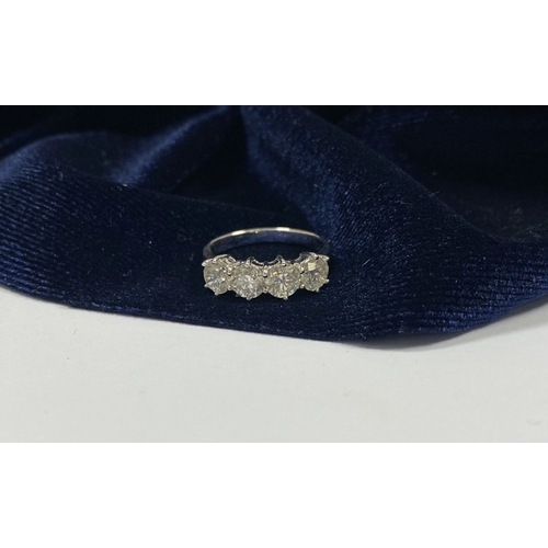 19 - AN 18CT WHITE GOLD FOUR STONE DIAMOND RING, the four round brilliant cut diamonds are claw set, tota... 