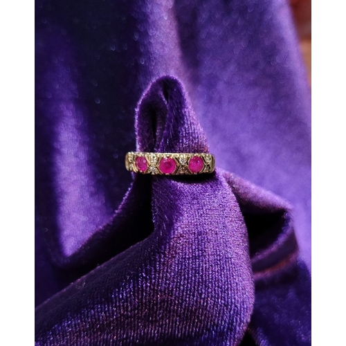 198 - AN ANTIQUE 9CT YELLOW GOLD 11 STONE RUBY & DIAMOND RING, with three round cut rubies and two diamond... 