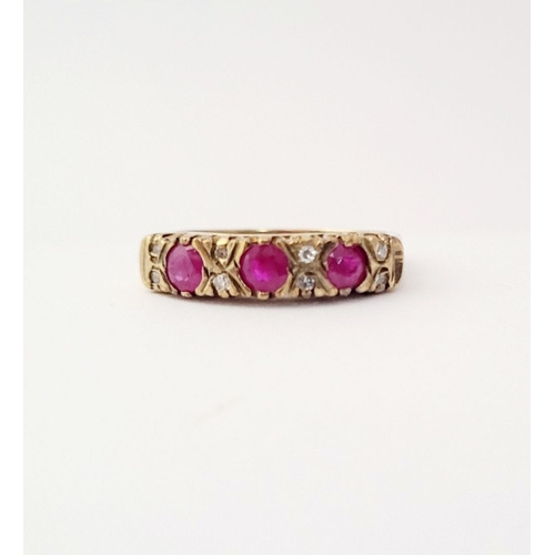 198 - AN ANTIQUE 9CT YELLOW GOLD 11 STONE RUBY & DIAMOND RING, with three round cut rubies and two diamond... 